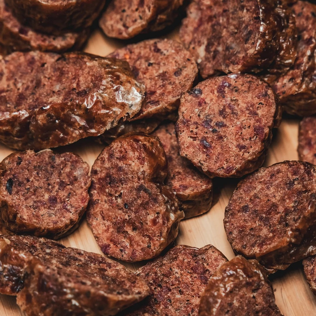 Close-up texture of dehydrated oxtail-infused sausage rounds